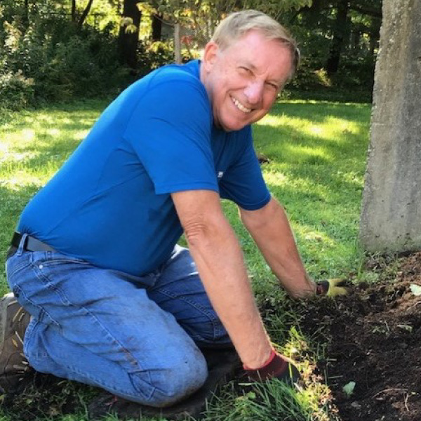 Volunteer Mike Perry helps maintain the grounds at the Main House of Ronald McDonald House Charities Ann Arbor